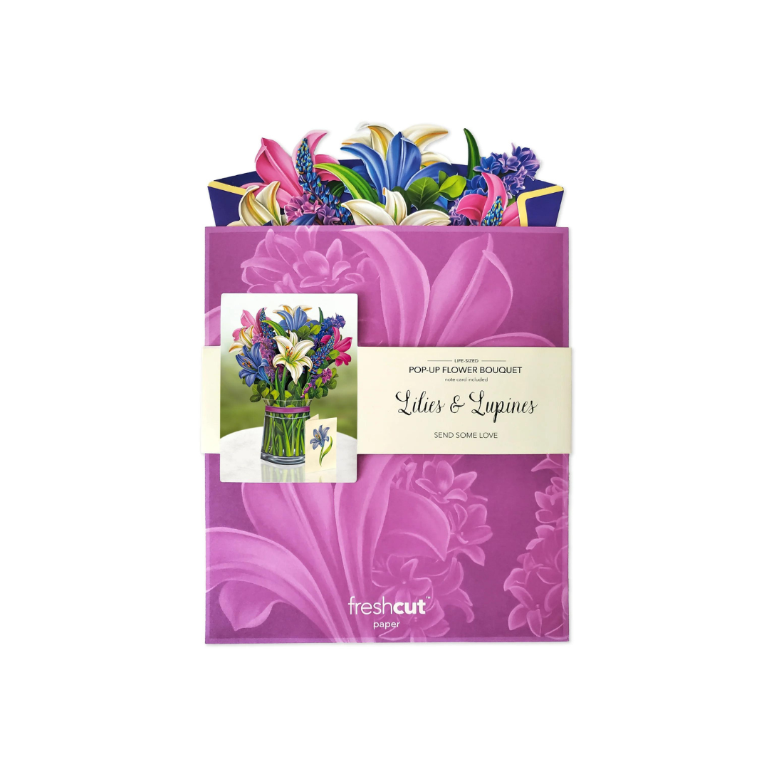Lilies & Lupines Pop Up Card featuring a detailed, life-like floral bouquet made of recycled paper, includes a blank note card for personal messages.