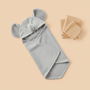 Gray hooded towel with bear ears on a beige background