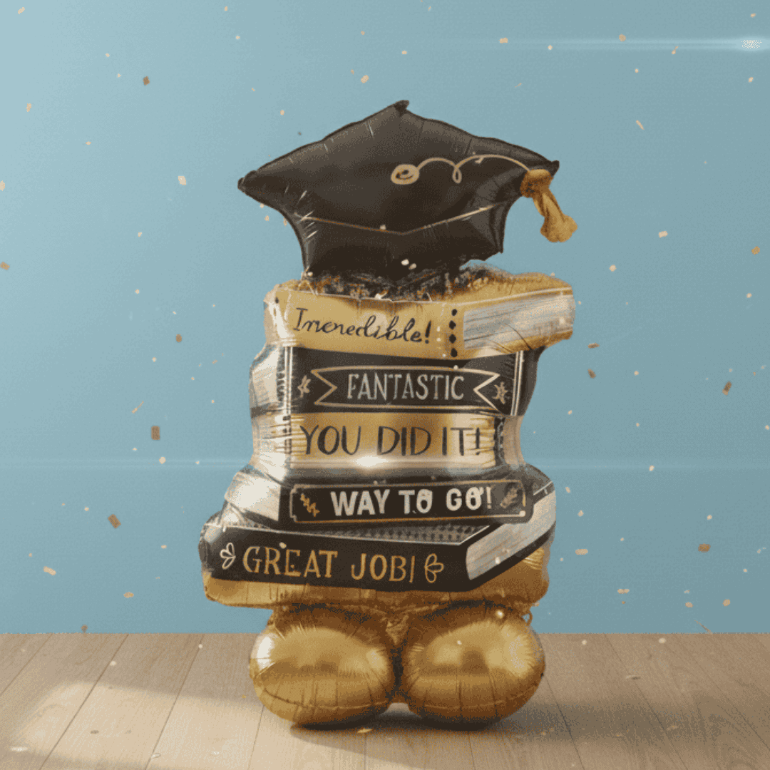Graduation-themed balloon with books and a cap on a blue background
