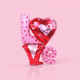 Pink, red and silver jumbo balloon that spells out 